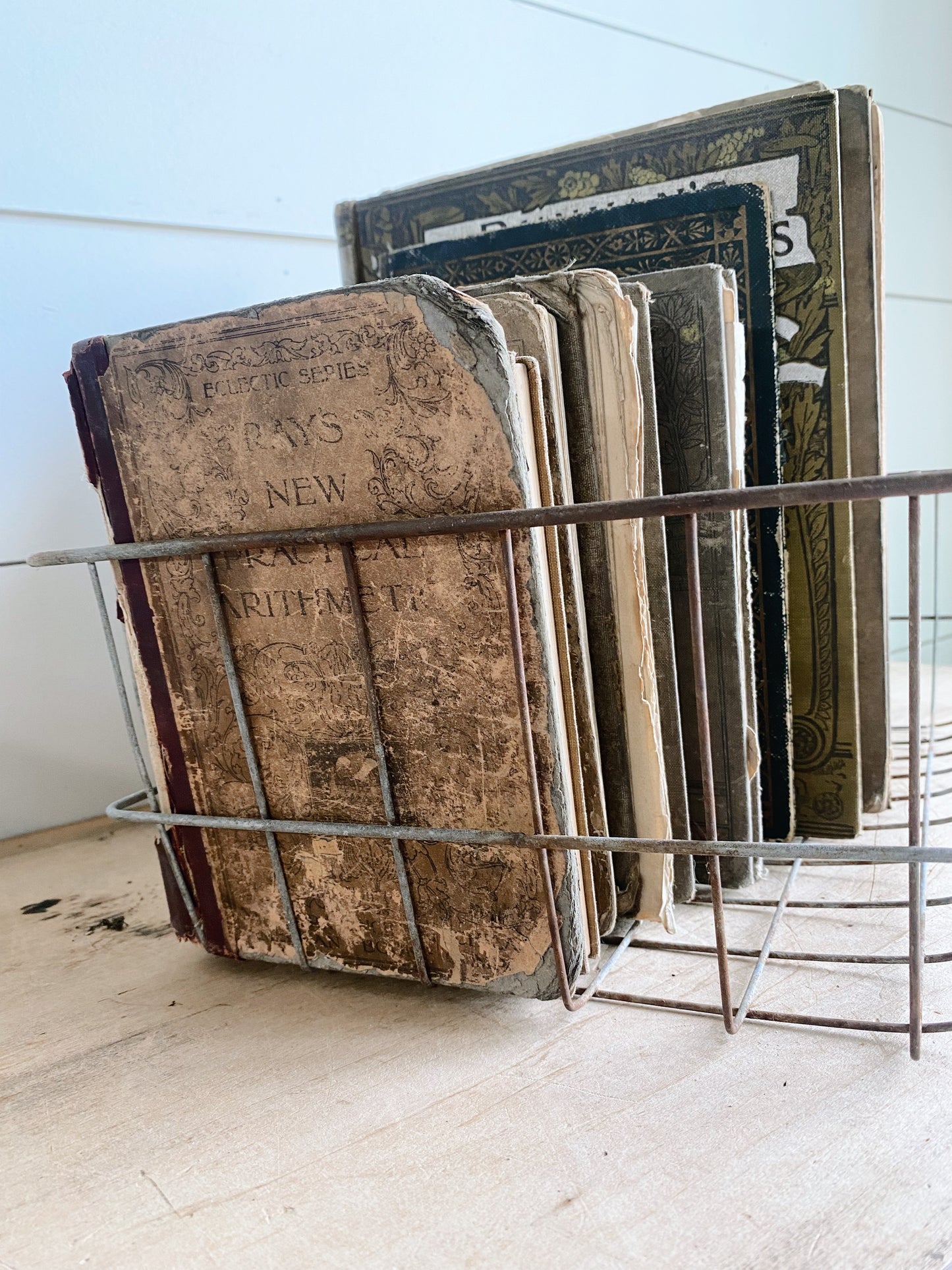 Collection of Vintage & Antique Books in a Vintage Wire Basket